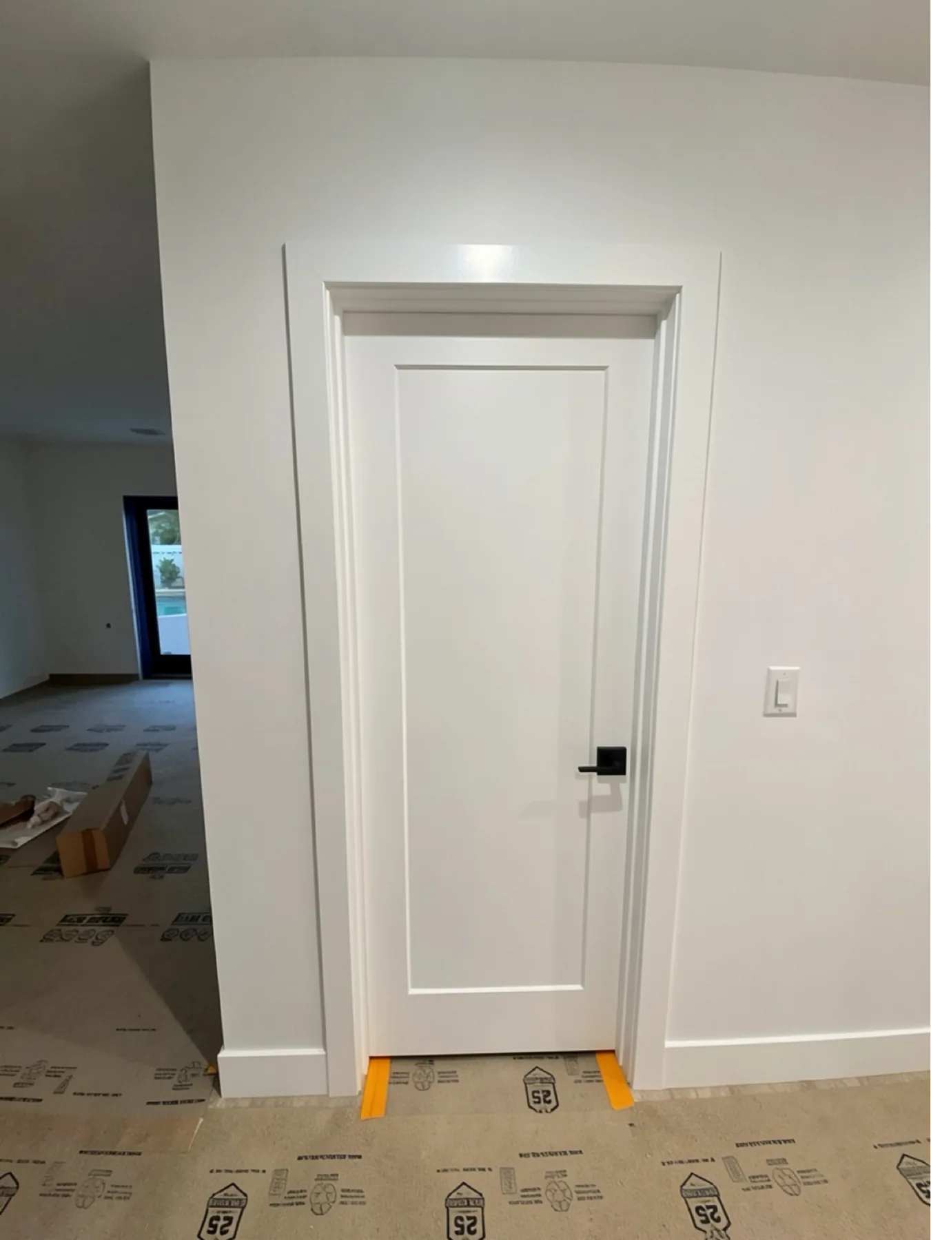 Finished single-panel interior door, casing, and hardware at E Calle Ventura