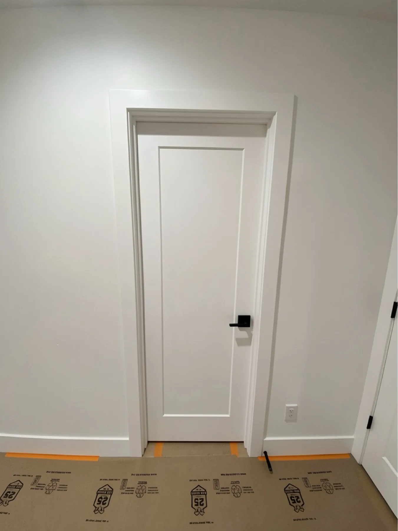 Finished interior door with casing and baseboard at E Calle Ventura