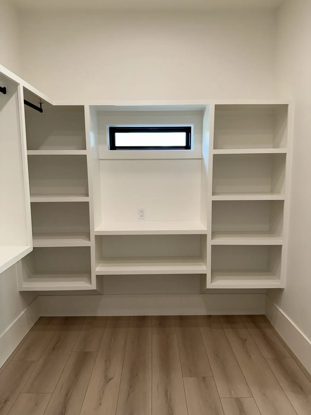 Closet shelving and closet rod installation at The El Sendero Project