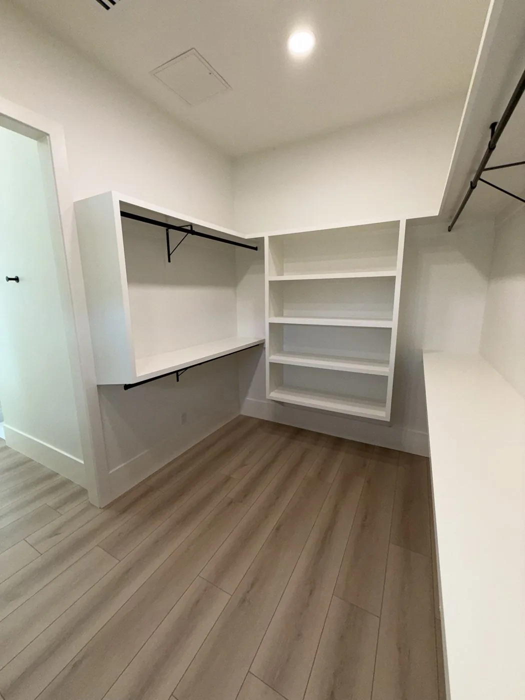 Closet with window jamb trim and 9 1/4 inch flat base at The El Sendero Project