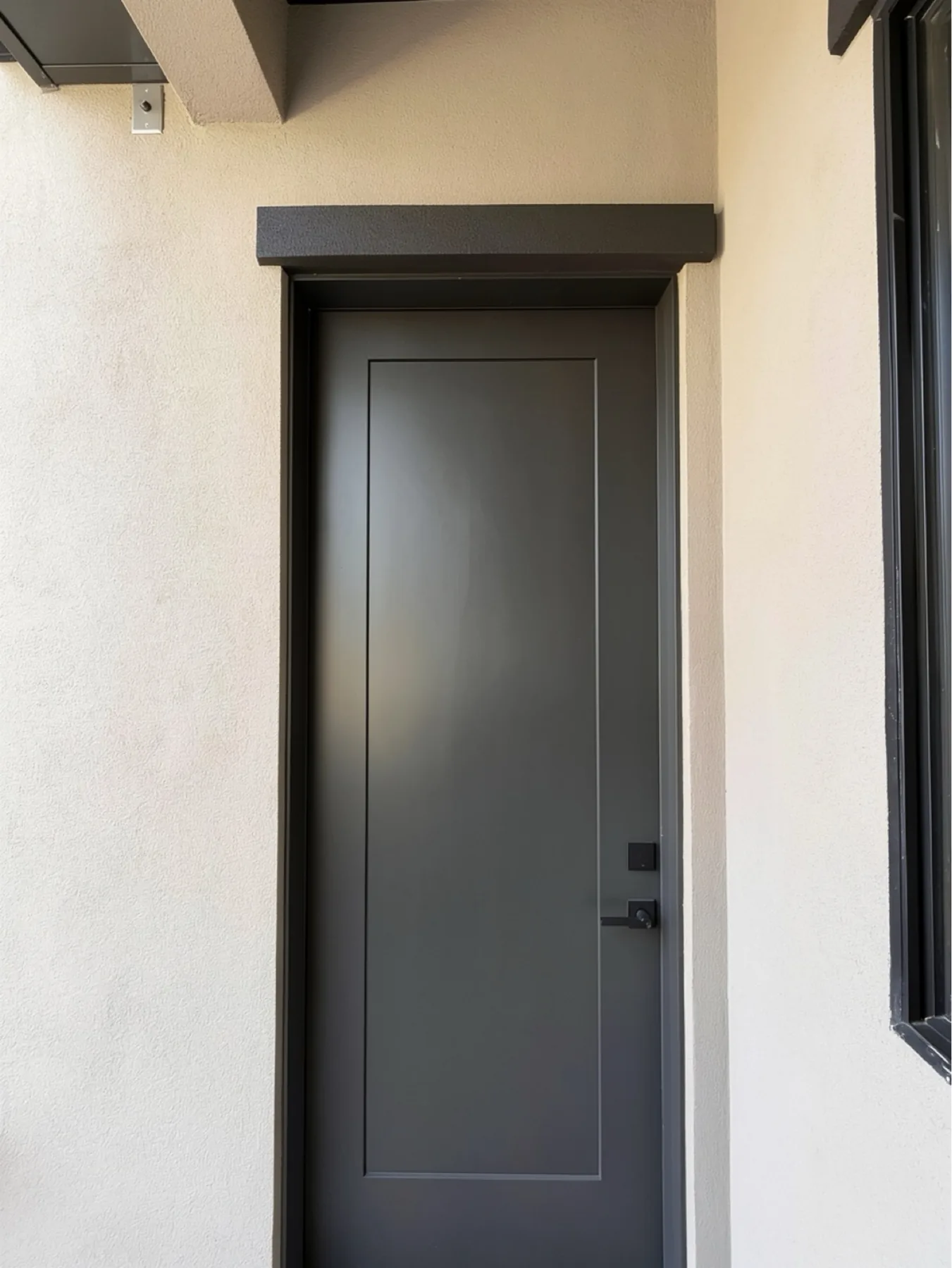 Exterior door casing and trim detail at The El Sendero Project