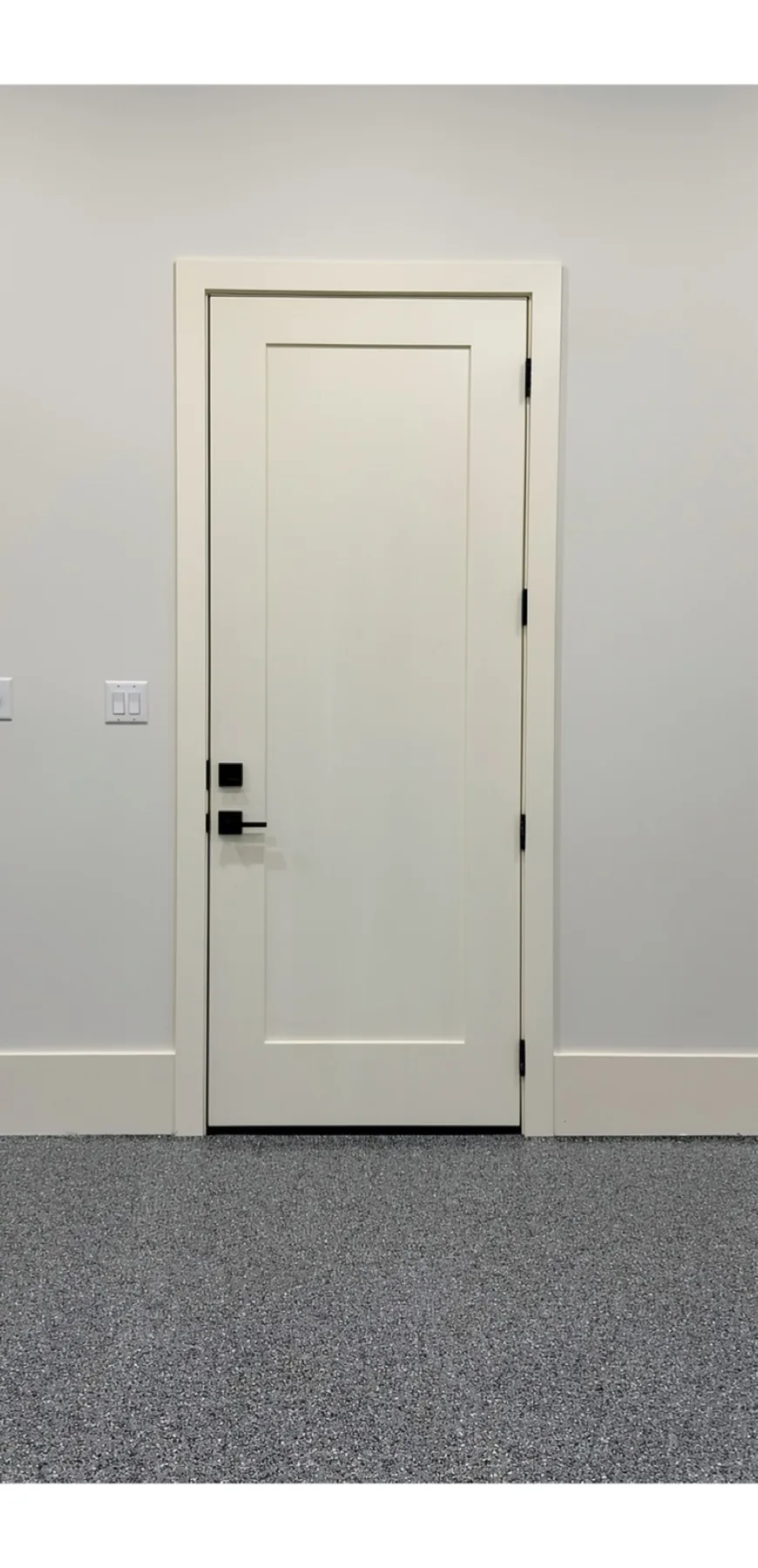 Solid-core single-panel door installation with hardware and 9 1/4 inch flat base at The El Sendero Project