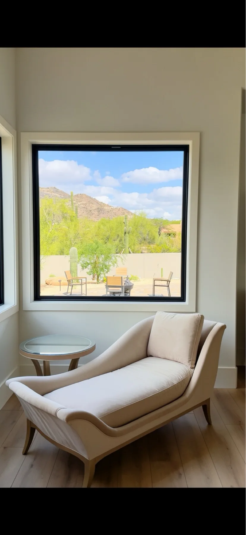 Window jamb and trim installation looking out to the desert at The El Sendero Project