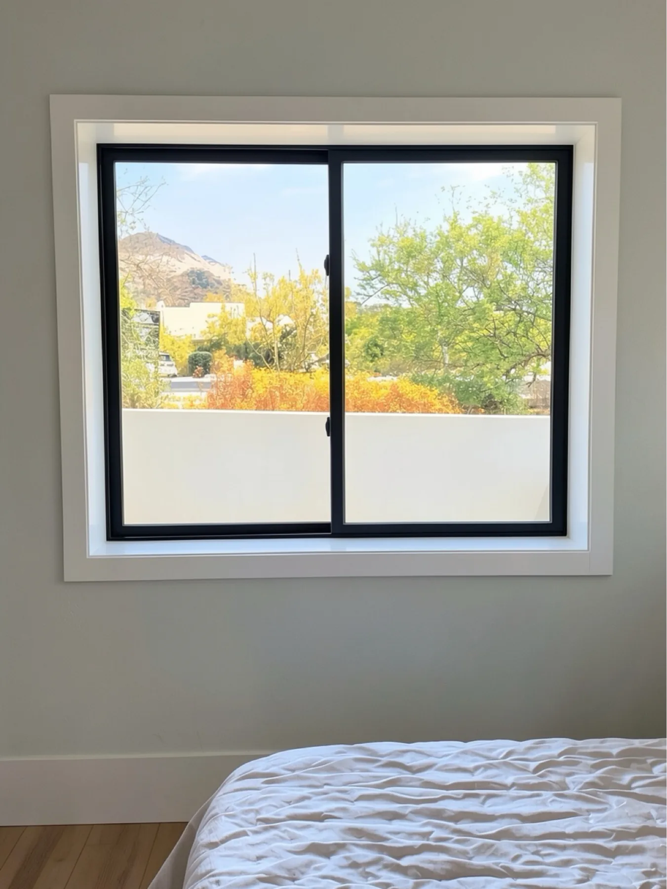 Bedroom window jamb and trim installation at The El Sendero Project