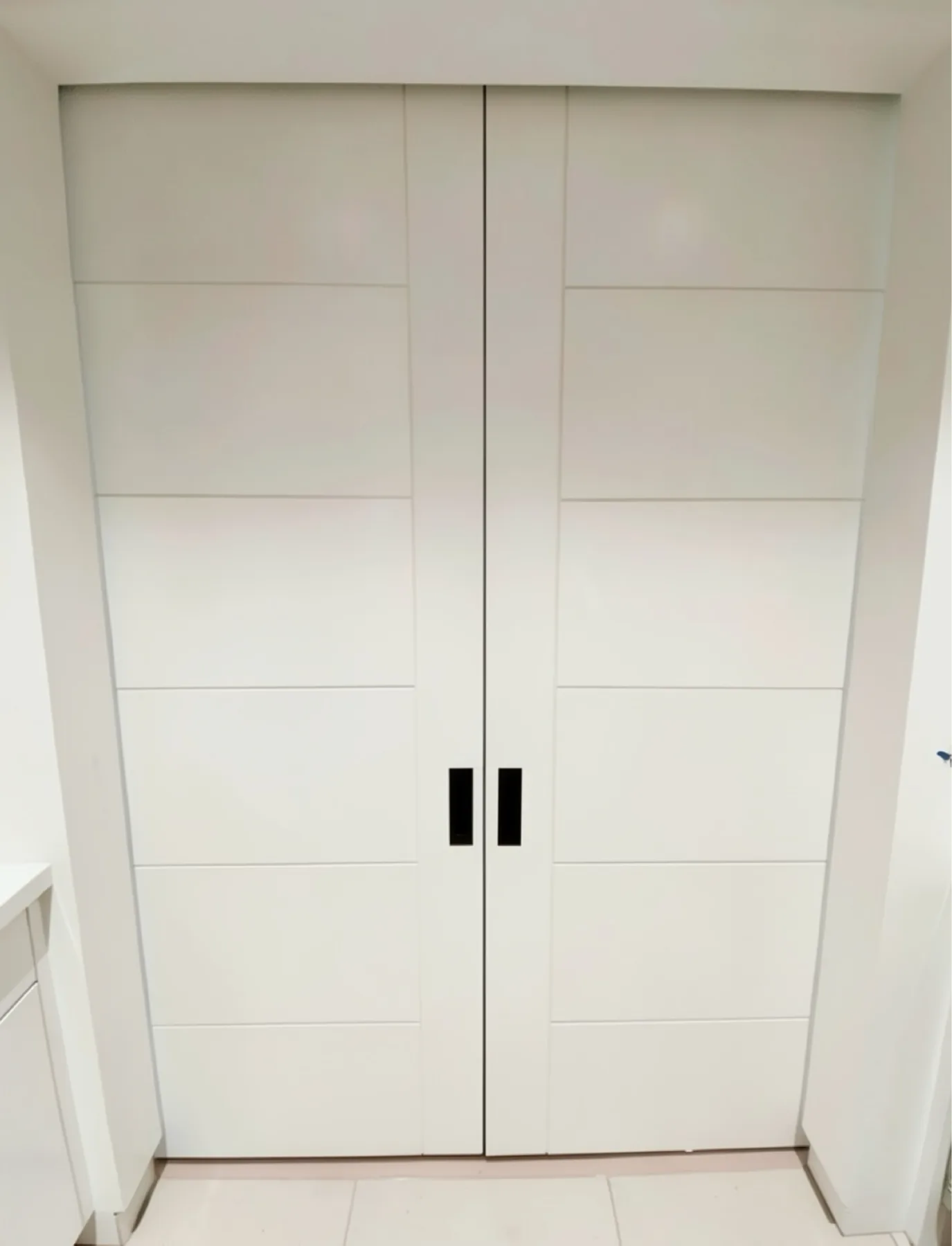 Finished double closet door installation at The Phoenician Project