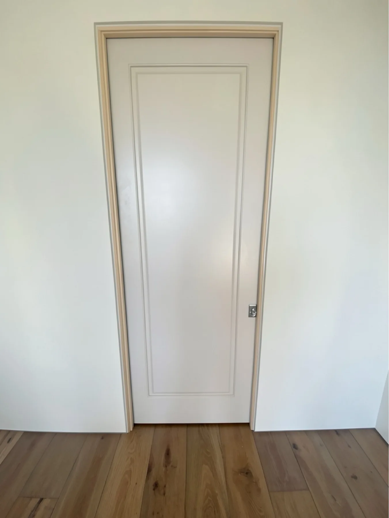 Finished pocket door panel and casing at The Phoenician Project