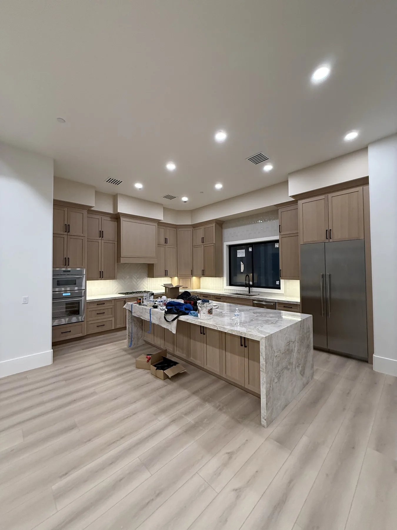 Custom soffit build-out above the kitchen cabinet run at The El Sendero Project